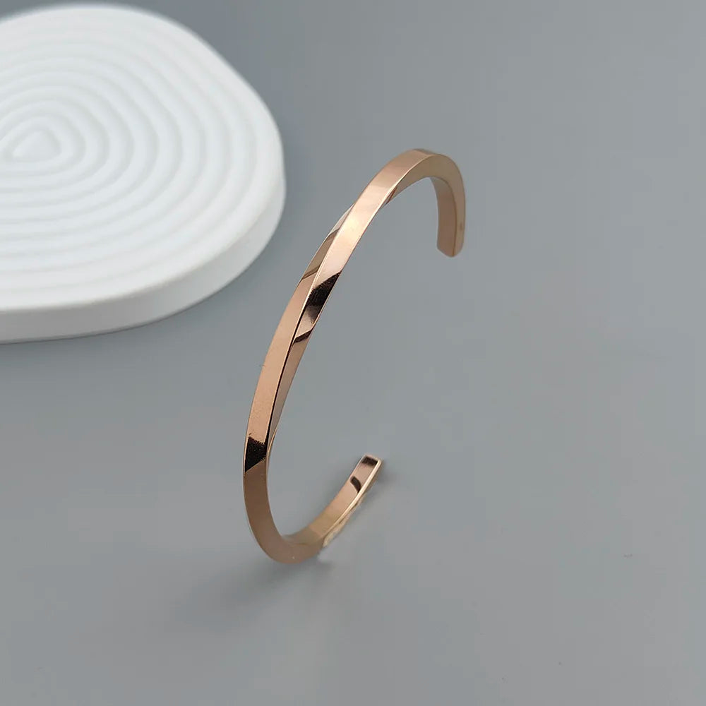 Metal lady's bracelet. Simple opening rotating rhombic stainless steel brooch. Jewelry for the wife's wedding party.
