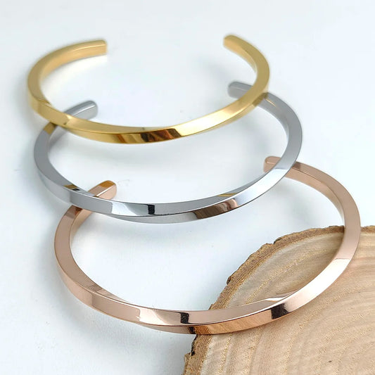 Metal lady's bracelet. Simple opening rotating rhombic stainless steel brooch. Jewelry for the wife's wedding party.
