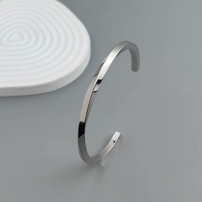 Metal lady's bracelet. Simple opening rotating rhombic stainless steel brooch. Jewelry for the wife's wedding party.