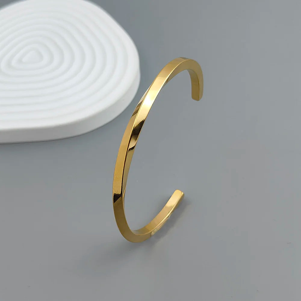 Metal lady's bracelet. Simple opening rotating rhombic stainless steel brooch. Jewelry for the wife's wedding party.