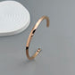 Metal lady's bracelet. Simple opening rotating rhombic stainless steel brooch. Jewelry for the wife's wedding party.